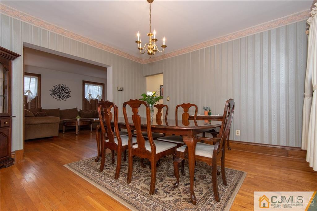77 Rector Street Metuchen, NJ 08840 - Photo 4 of 24 a view of a dining room with furniture window and wooden floor