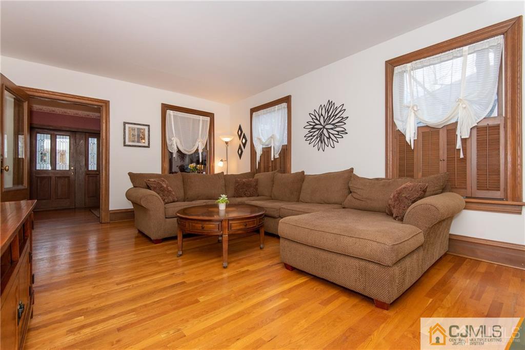 77 Rector Street Metuchen, NJ 08840 - Photo 5 of 24 a living room with furniture and a large window