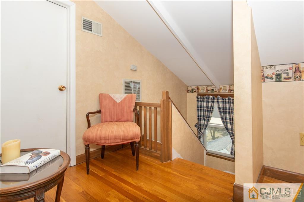 77 Rector Street Metuchen, NJ 08840 - Photo 10 of 24 a view of a hallway with furniture and wooden floor