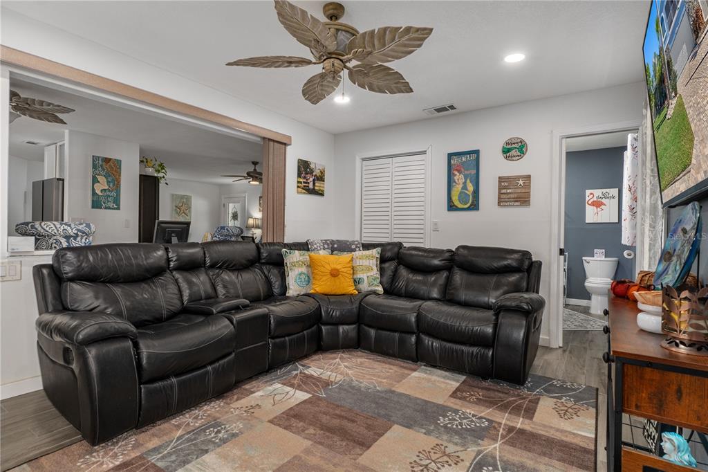 4128 Camelia Drive Hernando Beach, FL 34607 - Photo 20 of 50 a living room with furniture and a flat screen tv