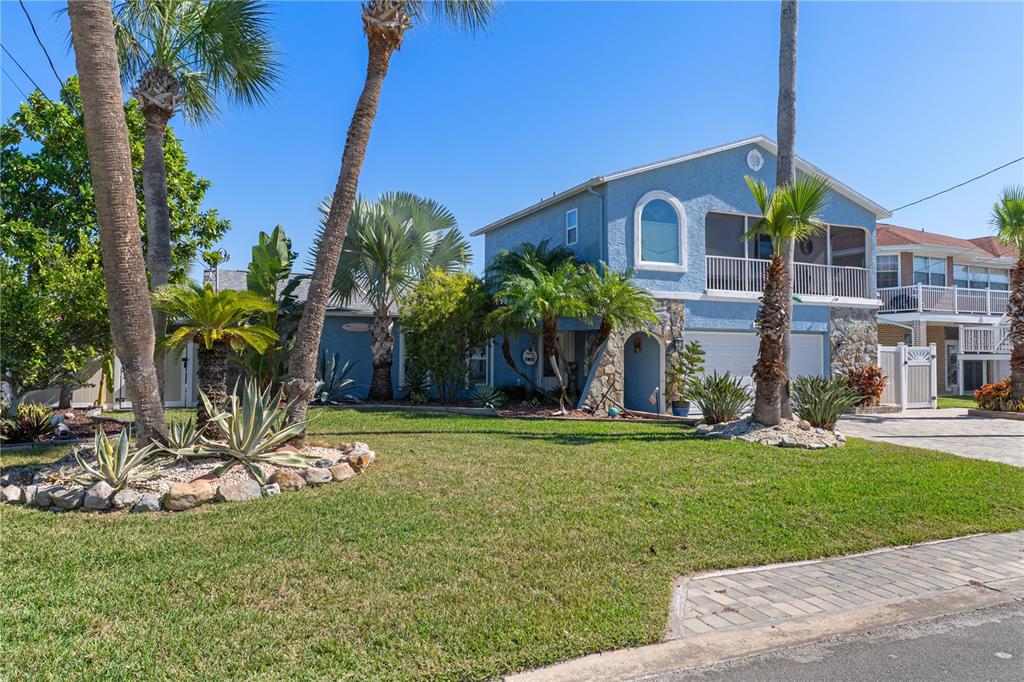 4128 Camelia Drive Hernando Beach, FL 34607 - Photo 3 of 50 a view of a house with a yard