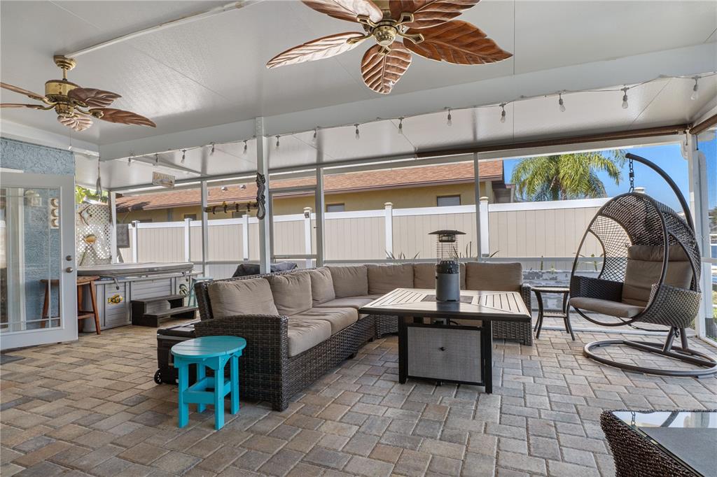 4128 Camelia Drive Hernando Beach, FL 34607 - Photo 36 of 50 a living room with fireplace furniture and a large window