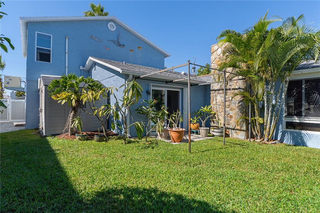 4128 Camelia Drive Hernando Beach, FL 34607 - Photo 42 of 50 a view of a house with backyard porch and sitting area