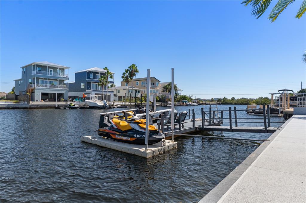 4128 Camelia Drive Hernando Beach, FL 34607 - Photo 45 of 50 a small pool with chairs and a table