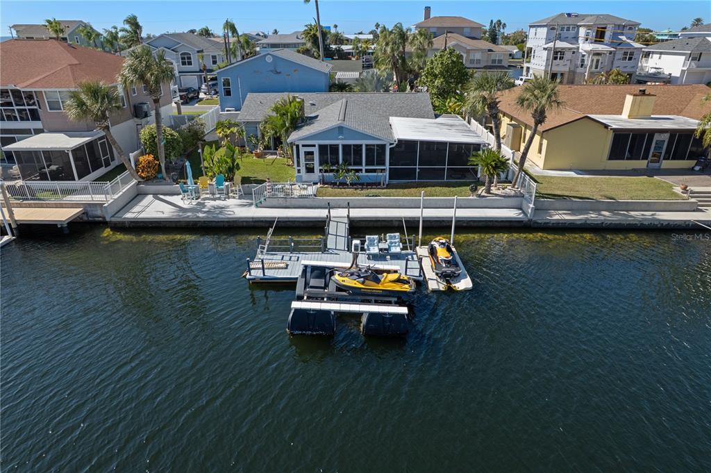 4128 Camelia Drive Hernando Beach, FL 34607 - Photo 46 of 50 an aerial view of a house with swimming pool patio and outdoor seating