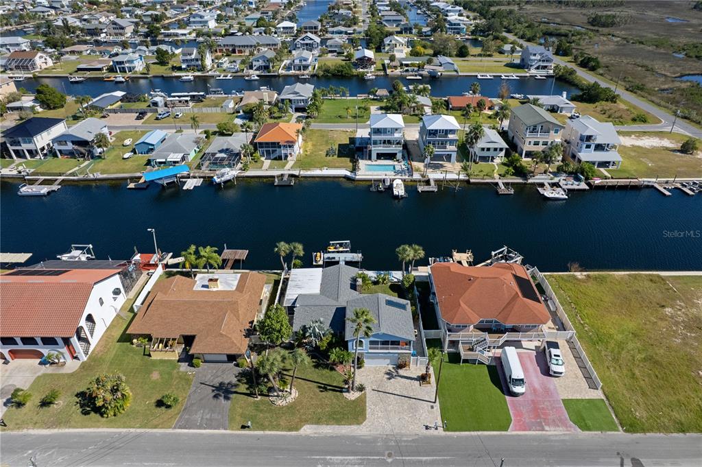 4128 Camelia Drive Hernando Beach, FL 34607 - Photo 48 of 50 an aerial view of a house with a swimming pool