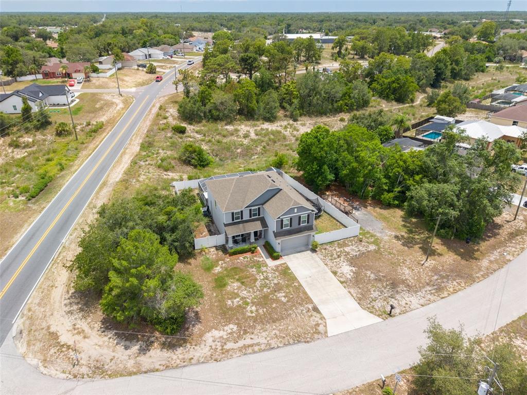 7242 Landmark Drive Spring Hill, FL 34606 - Photo 4 of 45 an aerial view of residential houses with outdoor space and trees