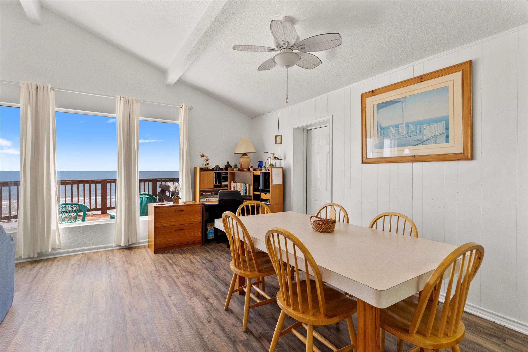 314 Beach Drive Surfside Beach, TX 77541 - Photo 12 of 38 a view of a dining room with furniture window and wooden floor