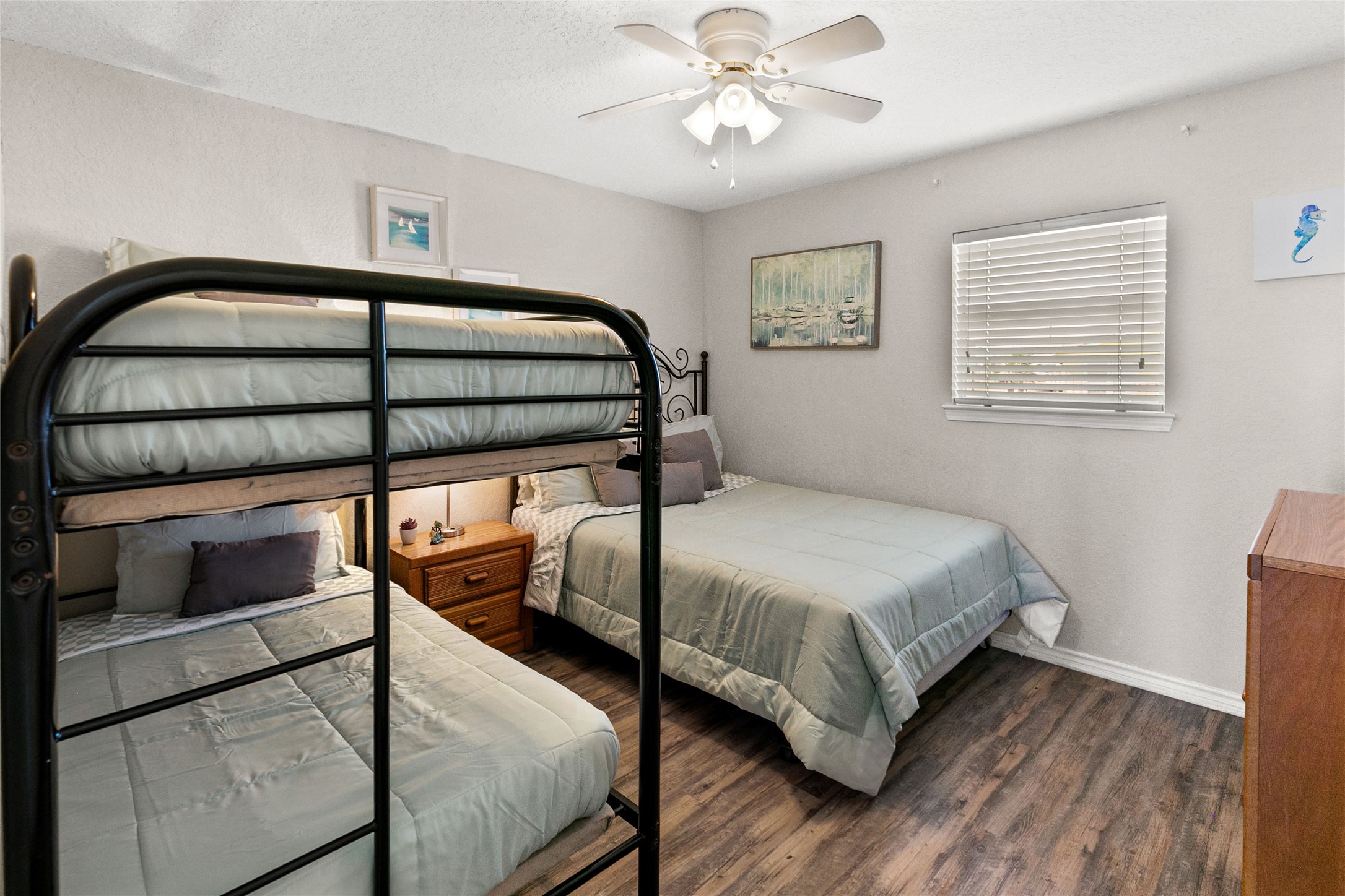 314 Beach Drive Surfside Beach, TX 77541 - Photo 17 of 38 a bedroom with a bed and a window