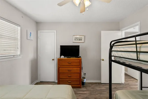 a view of room with closet and flat screen tv