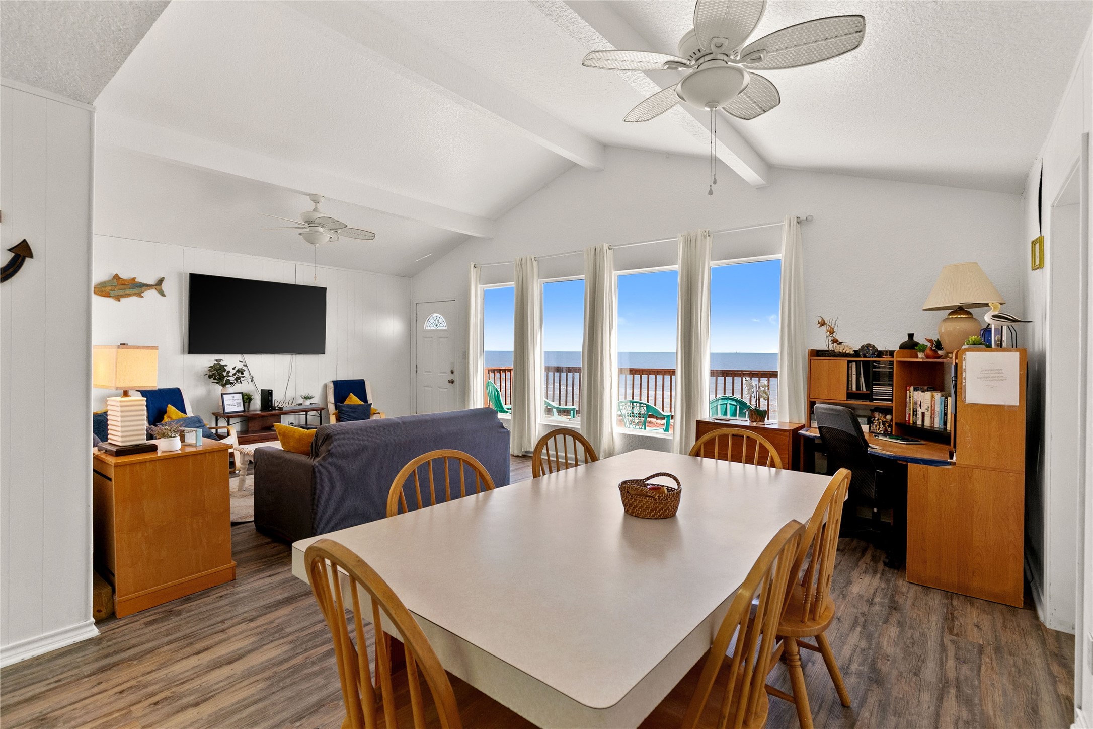 314 Beach Drive Surfside Beach, TX 77541 - Photo 22 of 38 a view of a dining room with furniture and wooden floor