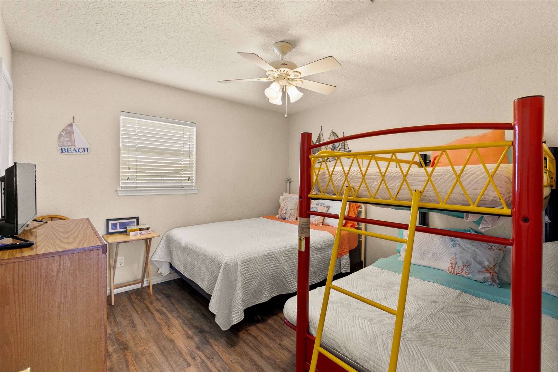 314 Beach Drive Surfside Beach, TX 77541 - Photo 32 of 38 a bedroom with a bed and a window
