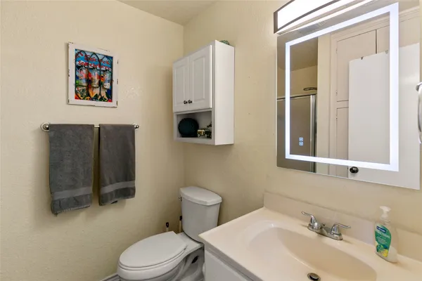 a view of a room with toys and wooden floor