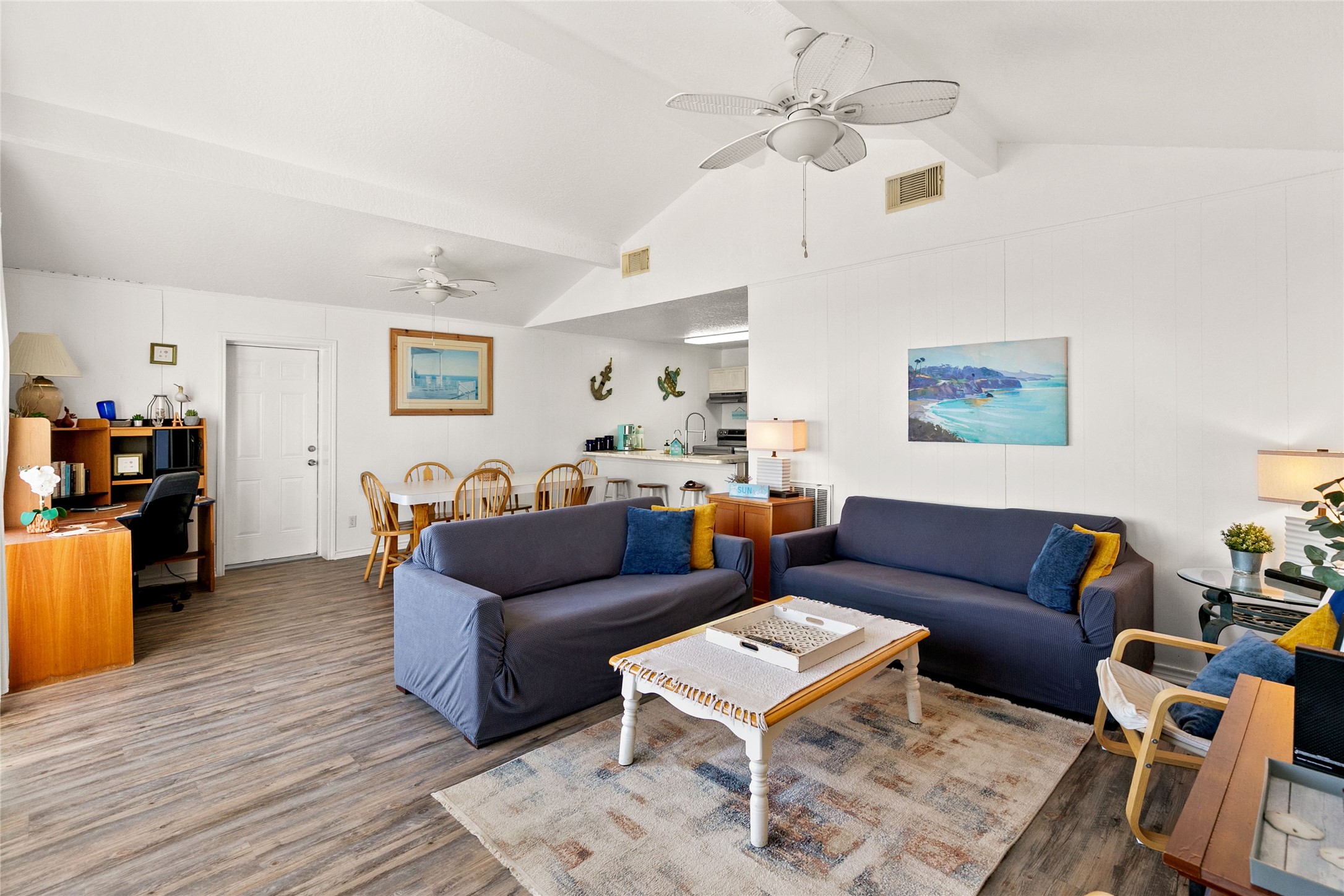 314 Beach Drive Surfside Beach, TX 77541 - Photo 9 of 38 a living room with furniture a ceiling fan and a rug