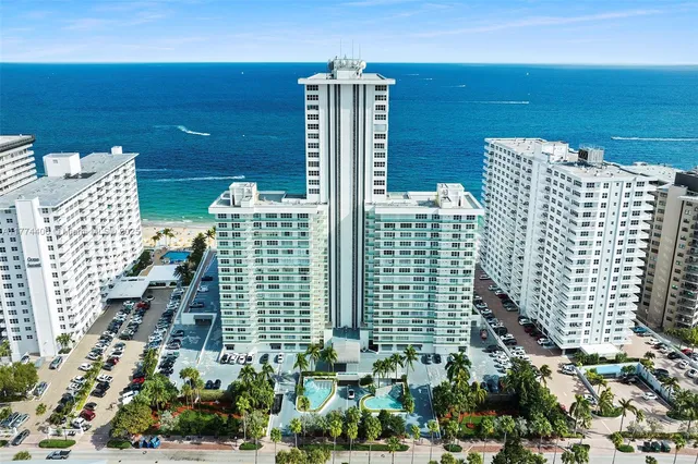 a view of swimming pool with outdoor seating