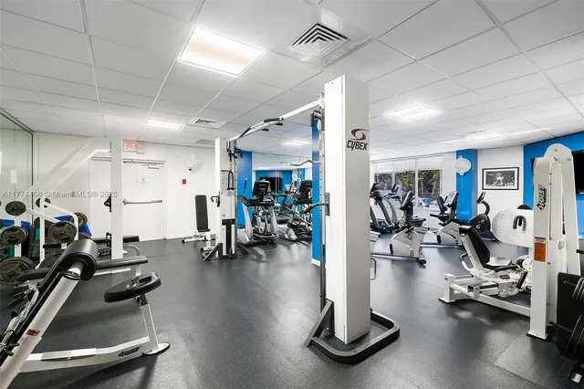 a bathroom with a sink and mirror with toilet