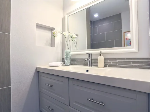 a bathroom with a sink and a mirror