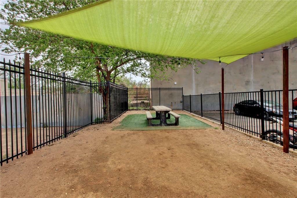 909 Reinli Street, Unit 217 Austin, TX 78751 - Photo 19 of 22 a view of backyard with wooden fence