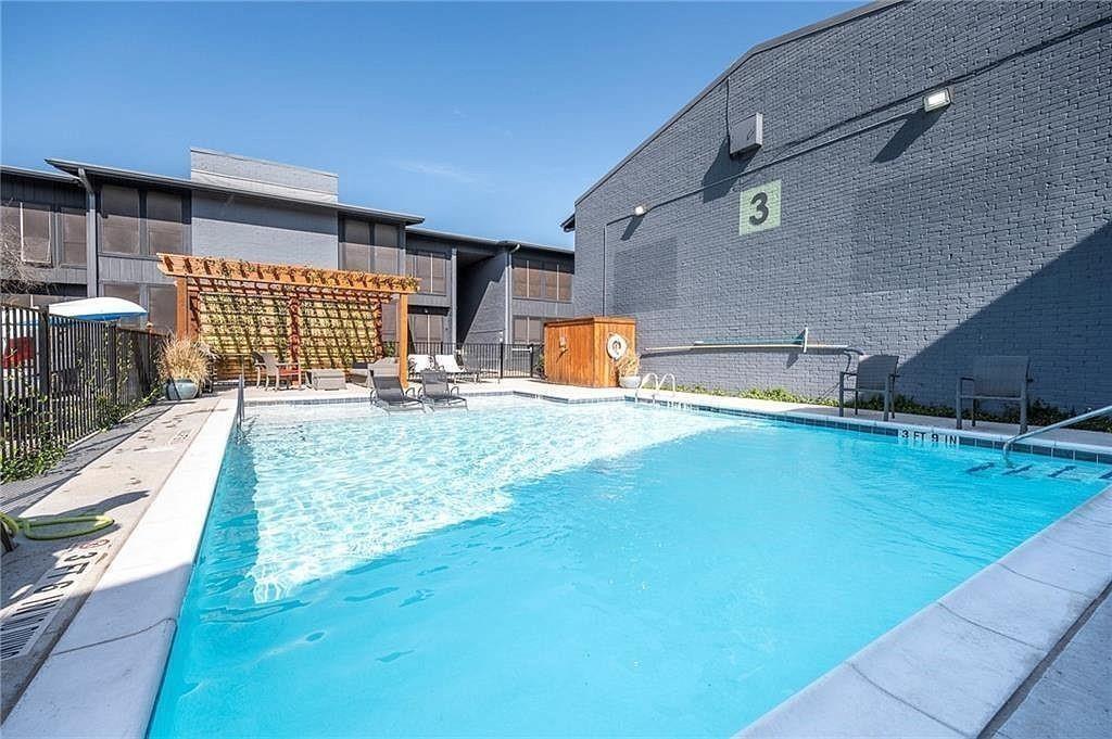 909 Reinli Street, Unit 217 Austin, TX 78751 - Photo 21 of 22 a view of a backyard with a patio