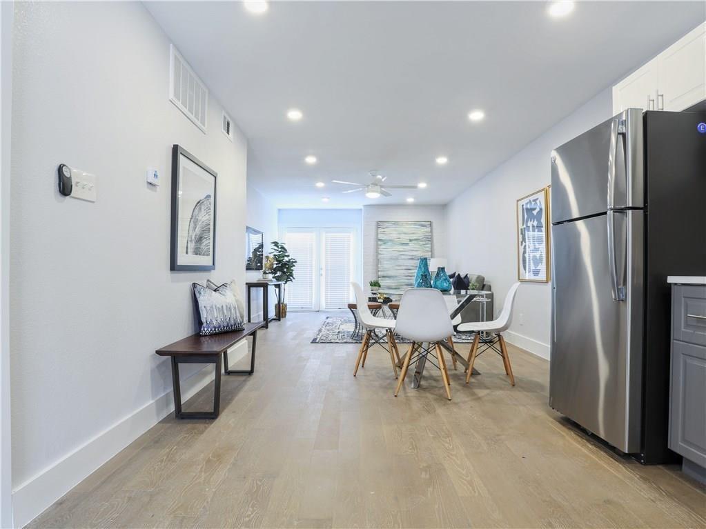 909 Reinli Street, Unit 217 Austin, TX 78751 - Photo 9 of 22 a view of a dining room with furniture