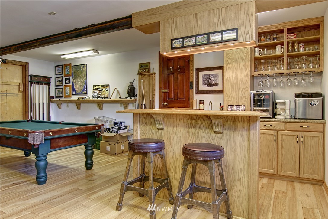 2461 Turn Point Road Friday Harbor, WA 98250 - Photo 13 of 25 a room with table chairs and wooden floors