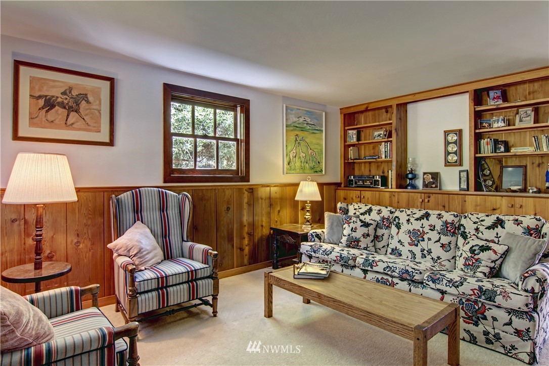2461 Turn Point Road Friday Harbor, WA 98250 - Photo 14 of 25 a living room with furniture lamp and book shelf