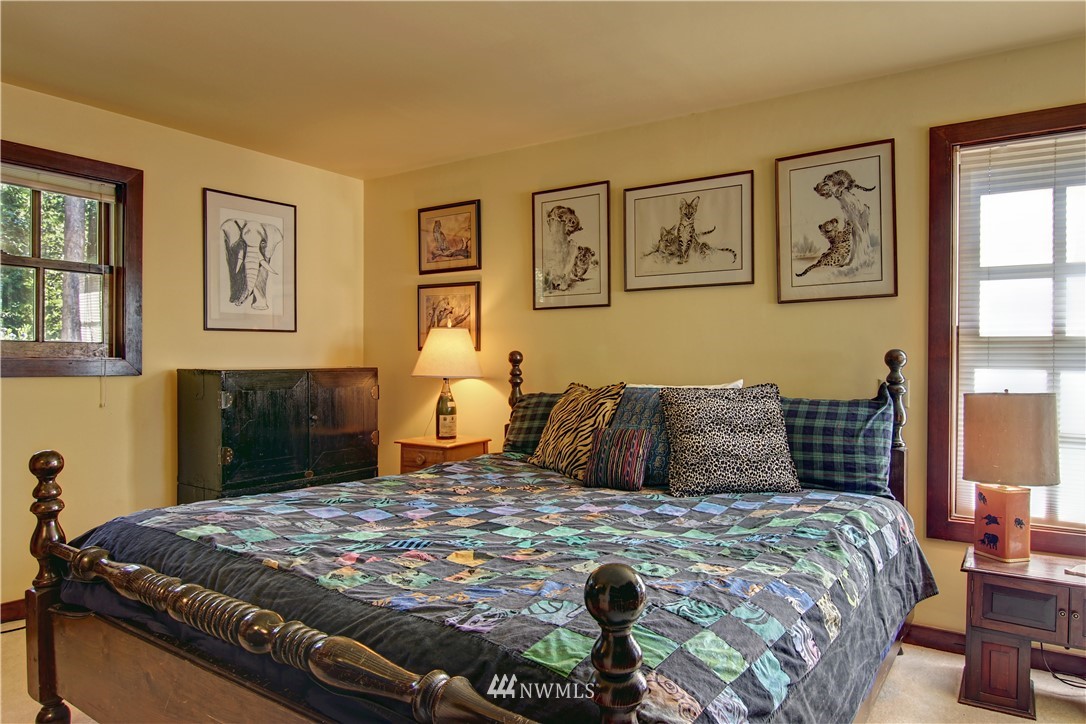 2461 Turn Point Road Friday Harbor, WA 98250 - Photo 16 of 25 a bedroom with a bed and window