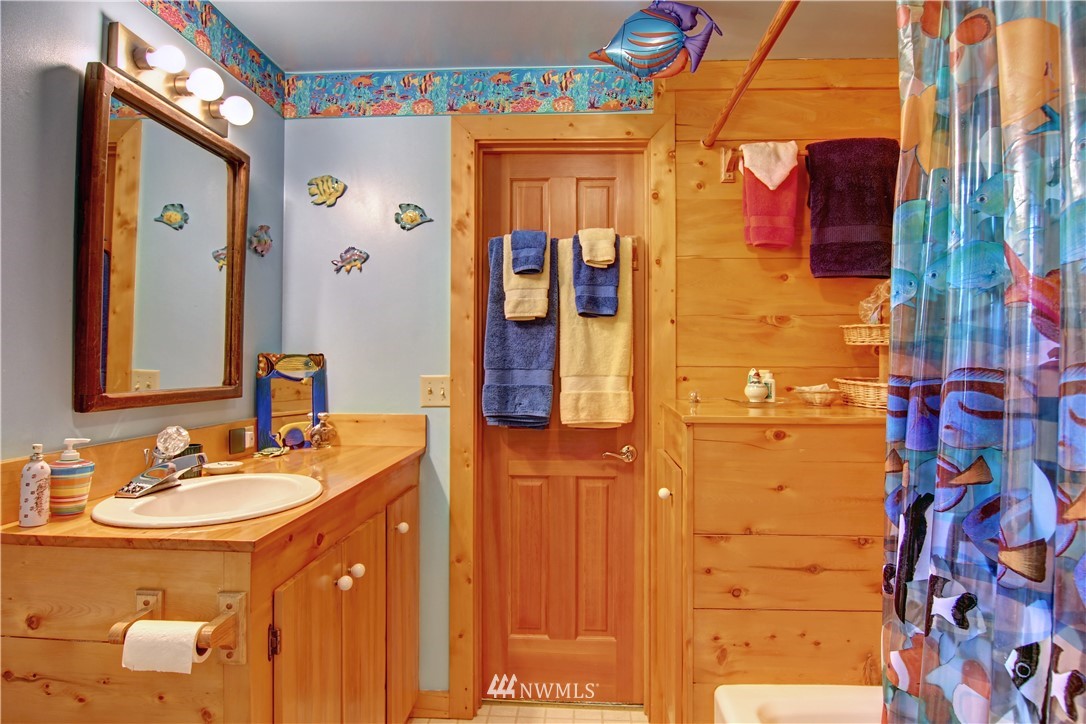 2461 Turn Point Road Friday Harbor, WA 98250 - Photo 18 of 25 a bathroom with a sink and a mirror
