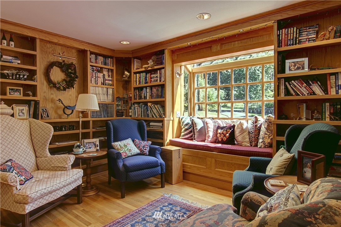 2461 Turn Point Road Friday Harbor, WA 98250 - Photo 4 of 25 a living room with furniture and a bookshelf