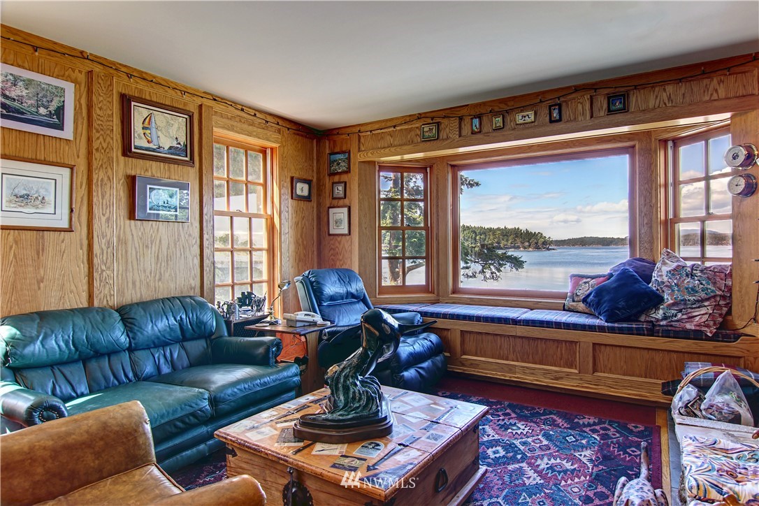 2461 Turn Point Road Friday Harbor, WA 98250 - Photo 8 of 25 a living room with furniture and a large window