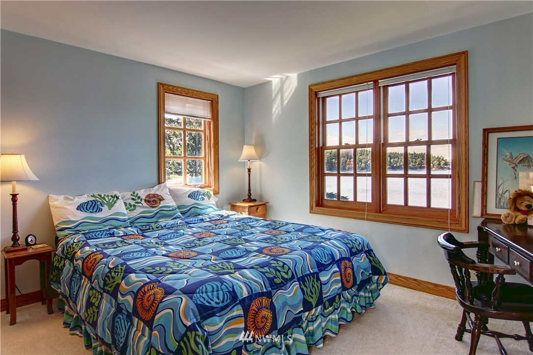 2461 Turn Point Road Friday Harbor, WA 98250 - Photo 10 of 25 a bedroom with a bed and a window