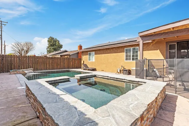 a view of a patio with swimming pool