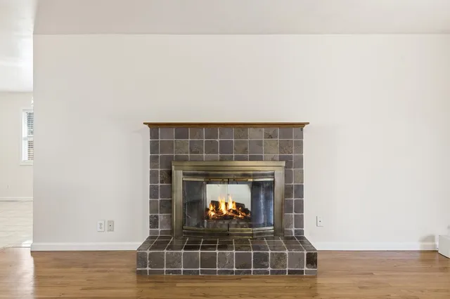a living room with a fireplace