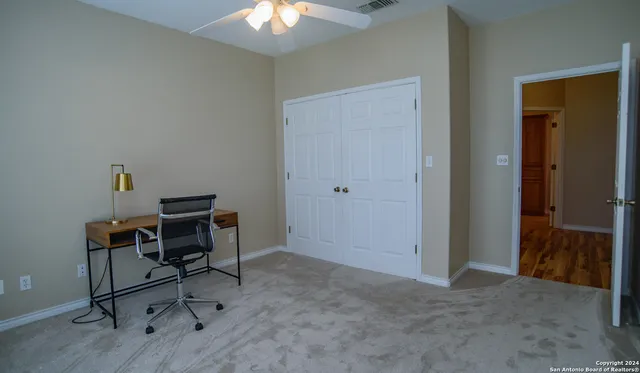 a view of a workspace with furniture