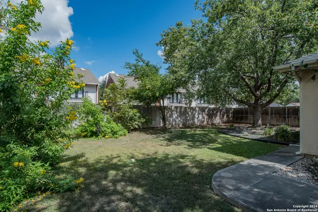 a view of a backyard with a garden