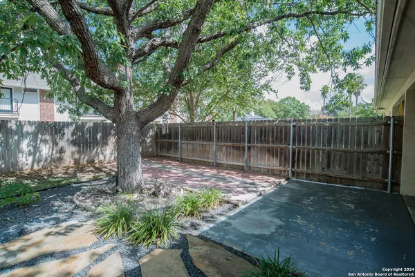 a backyard of a house with lots of green space