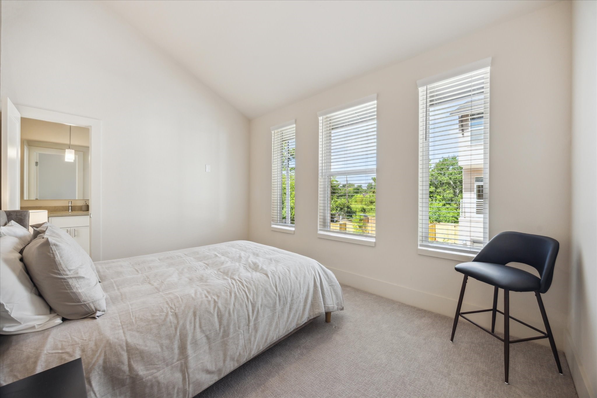 5903 Urban Pines Street Houston, TX 77091 - Photo 20 of 42 a bedroom with a bed and a window