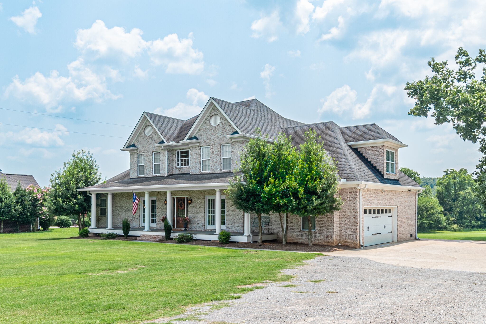 3973 Franklin Road Lebanon, TN 37090 - Photo 3 of 50 a front view of a house with a garden and porch