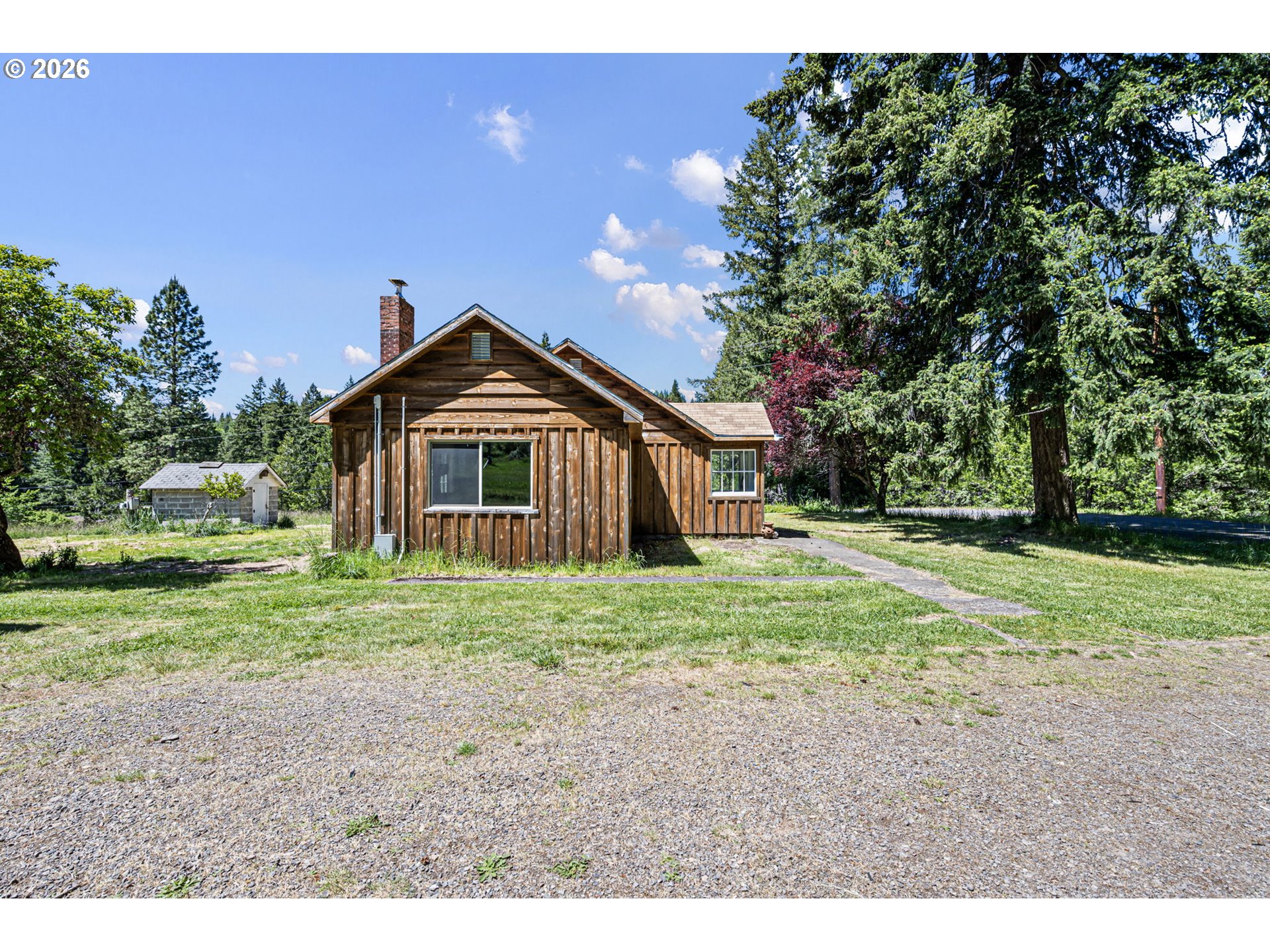 77521 Brock Road Oakridge, OR 97463 - Photo 43 of 48 a front view of a house with a yard