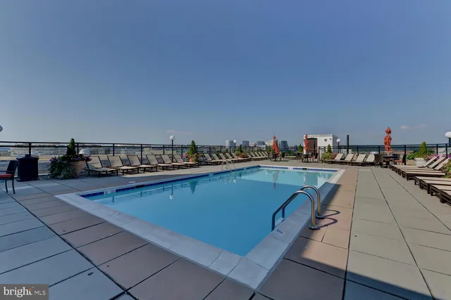a terrace with outdoor seating and city view