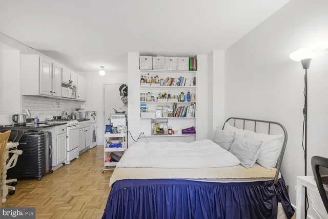 a kitchen with a sink a stove and cabinets