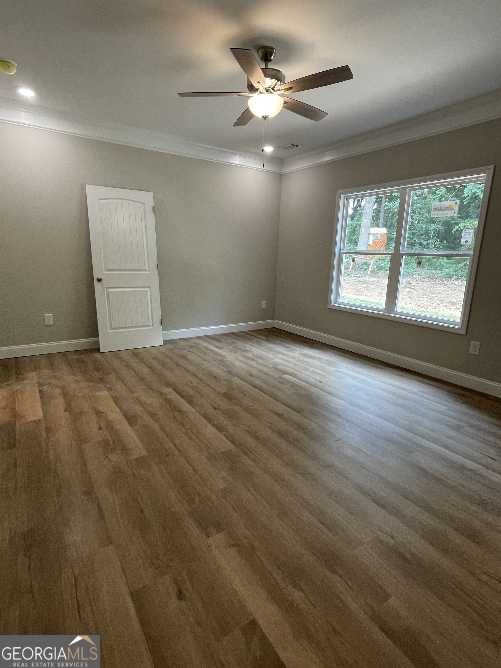 115 Drues Road Bowdon, GA 30108 - Photo 8 of 13 a view of an empty room with a window