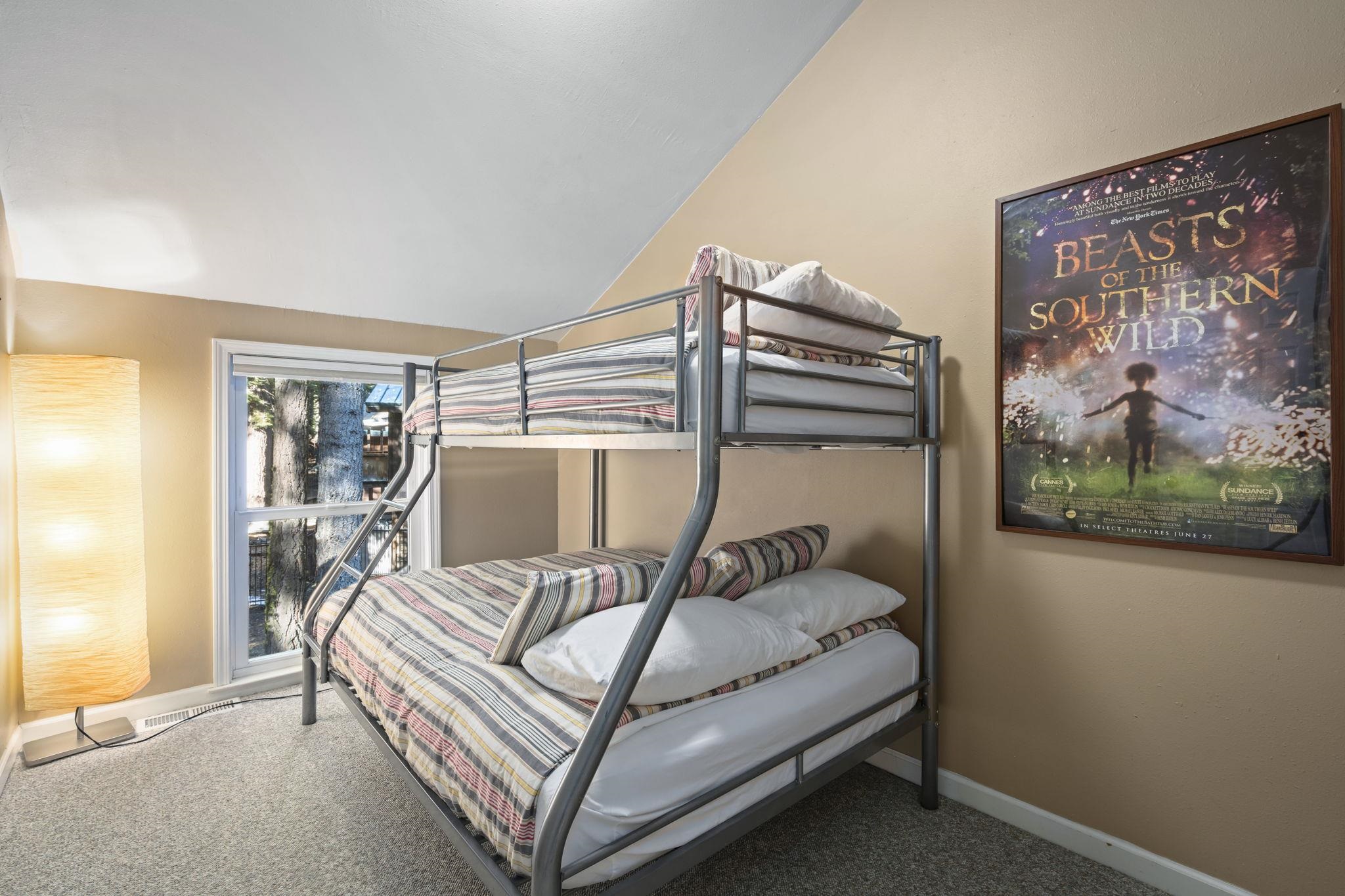 6415 Flicker Avenue Homewood, CA 96141 - Photo 11 of 28 a bed sitting in a bedroom next to a window