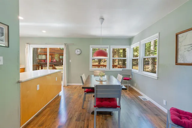 a workspace with furniture window and wooden floor