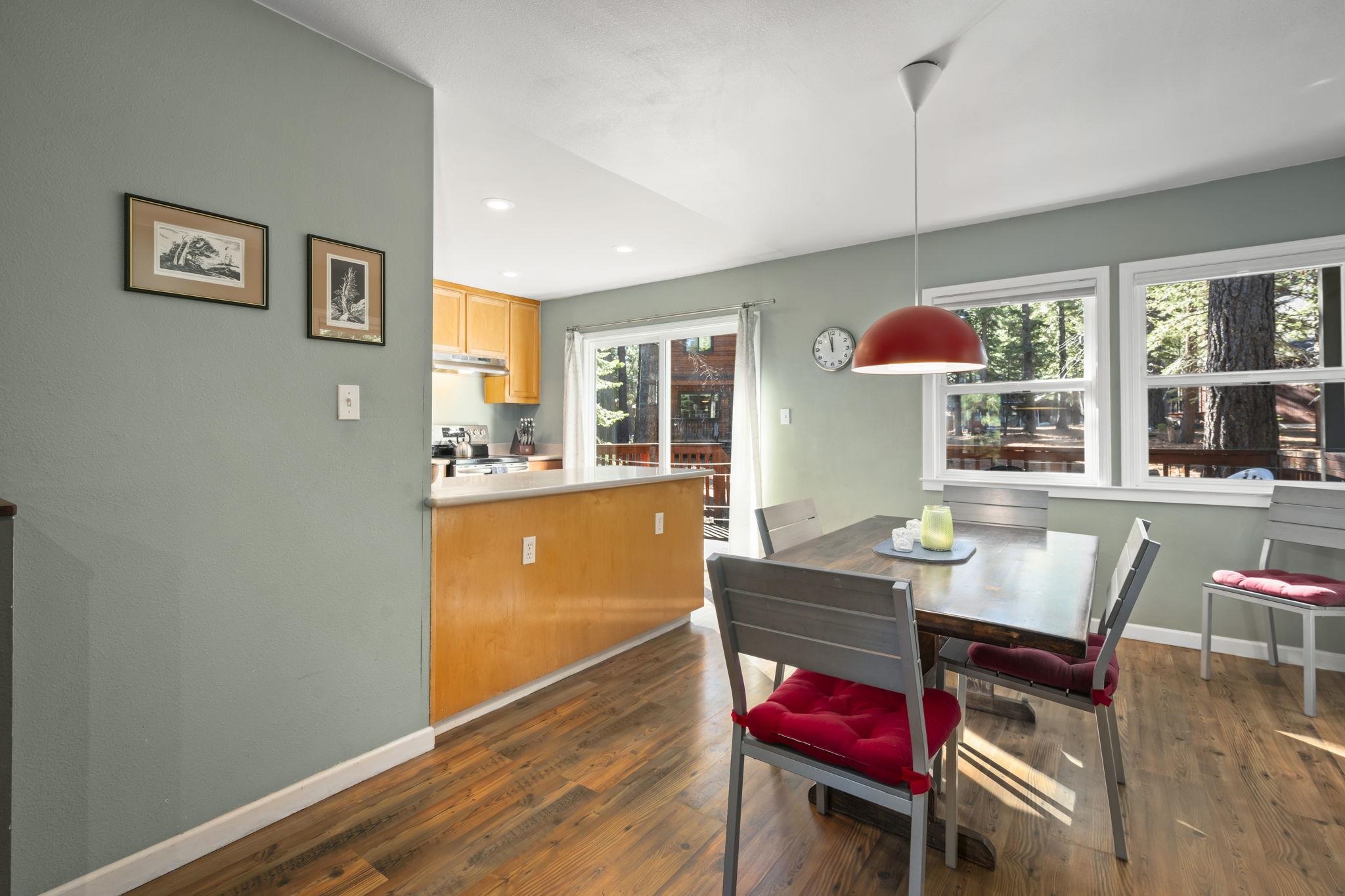 6415 Flicker Avenue Homewood, CA 96141 - Photo 14 of 28 a view of a dining room with furniture window and wooden floor