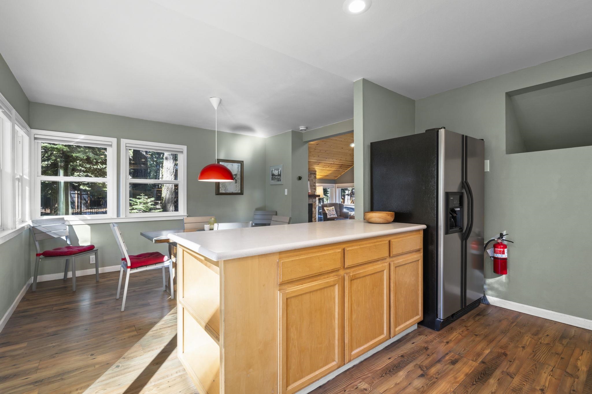 6415 Flicker Avenue Homewood, CA 96141 - Photo 16 of 28 a kitchen that has a lot of cabinets and wooden floor