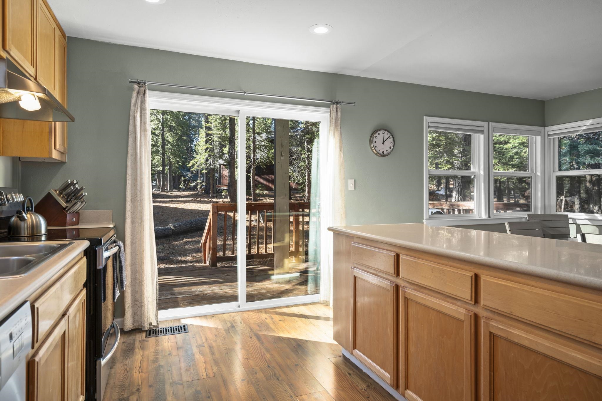 6415 Flicker Avenue Homewood, CA 96141 - Photo 17 of 28 a kitchen with granite countertop a stove and a sink