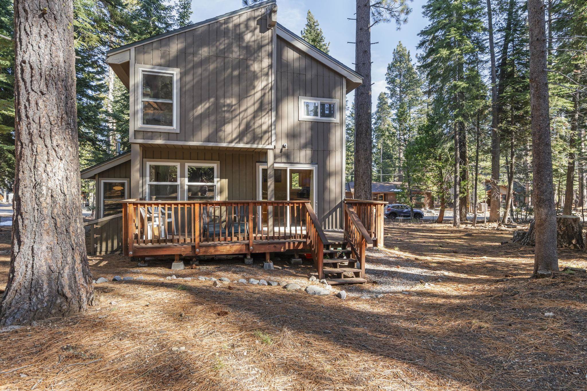 6415 Flicker Avenue Homewood, CA 96141 - Photo 20 of 28 a view of a house with a yard and wooden fence