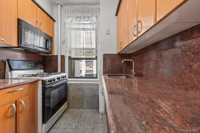 a kitchen with a stove and a microwave