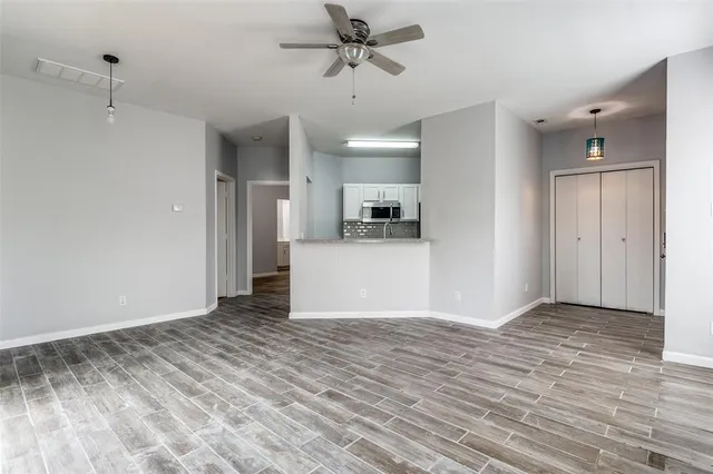 a view of a kitchen with a sink and cabinets